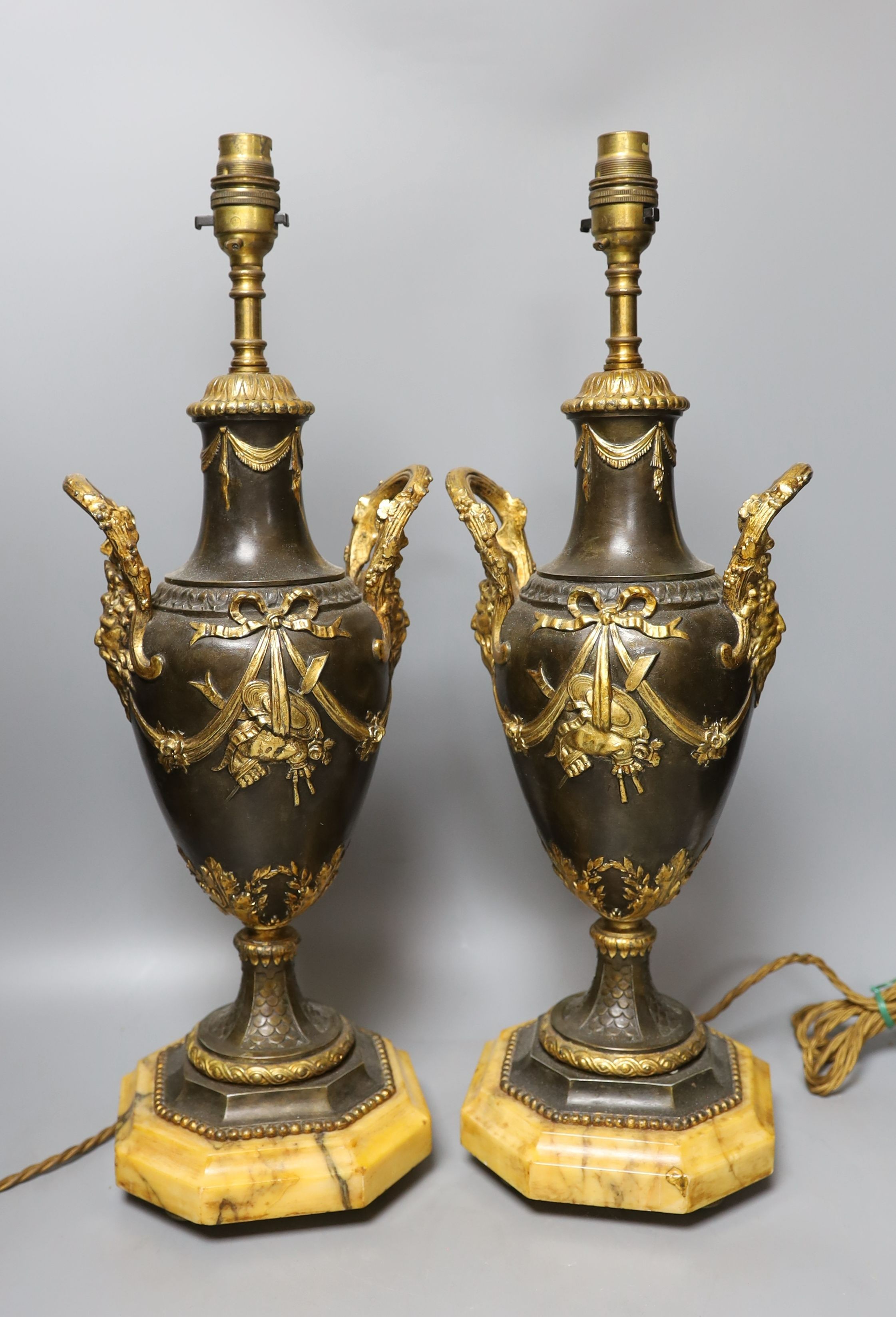 A pair of decorative brass and gilt ‘urn' lamps - 51cm tall